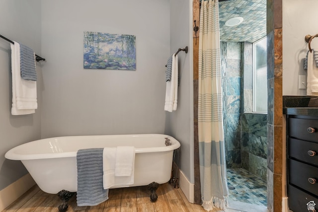 225 S 900 E, Salt Lake City, UT 84102 - bathroom featuring a shower stall, a freestanding bath, wood finished floors, and baseboards