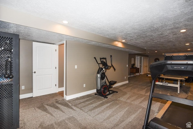 workout area featuring carpet, baseboards, a textured ceiling, and recessed lighting