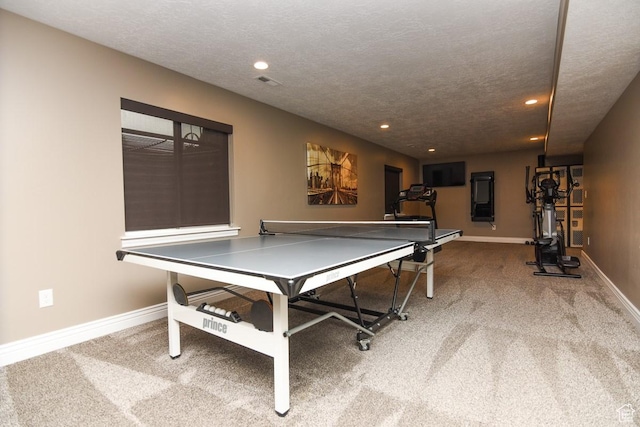 rec room featuring carpet, baseboards, recessed lighting, and a textured ceiling