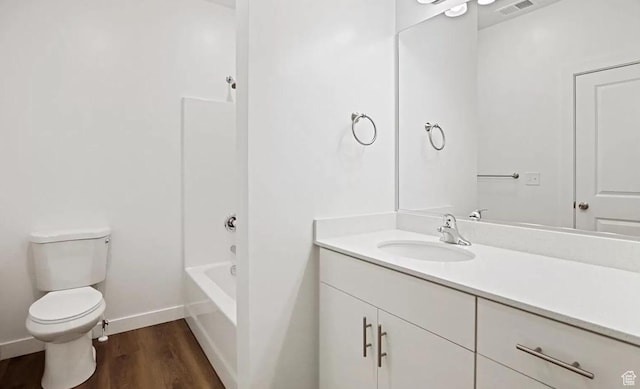 473 W 40 S Unit H 204, Providence, UT 84332 - bathroom featuring toilet, vanity, wood finished floors, baseboards, and shower / washtub combination