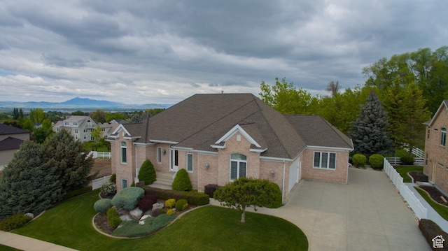 1315 E 1550 N, North Logan, UT 84341 - traditional-style house with driveway, brick siding, a garage, and a mountain view