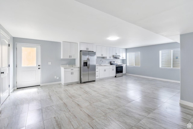 701 S Crooket Post Way W, Saratoga Springs, UT 84045 - kitchen with stainless steel appliances, a sink, baseboards, light countertops, and white cabinets