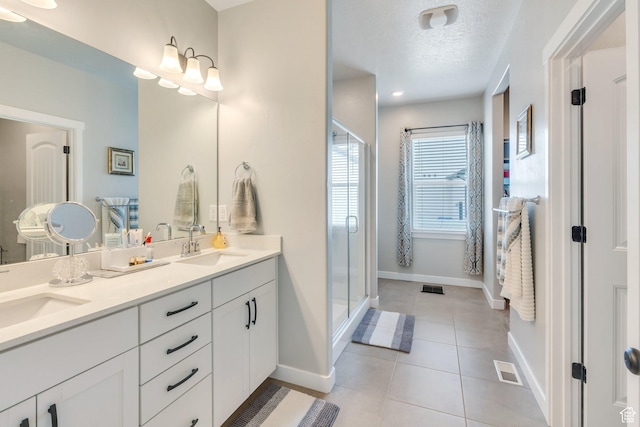 701 S Crooket Post Way W, Saratoga Springs, UT 84045 - full bath with baseboards, double vanity, a shower stall, tile patterned flooring, and a textured ceiling