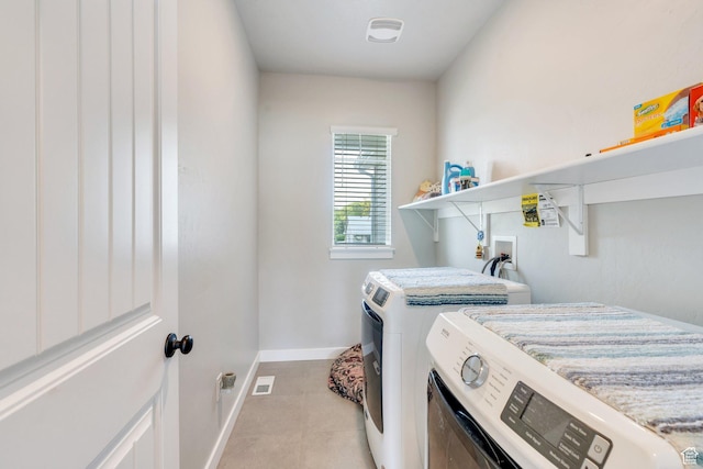 701 S Crooket Post Way W, Saratoga Springs, UT 84045 - washroom with washing machine and dryer, light tile patterned floors, and baseboards