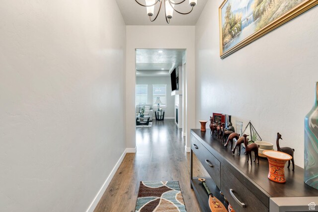 701 S Crooket Post Way W, Saratoga Springs, UT 84045 - corridor with wood finished floors, a chandelier, and baseboards