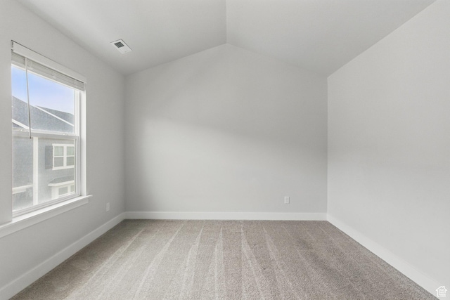 bonus room featuring light carpet, vaulted ceiling, and baseboards