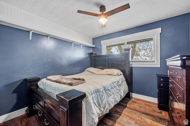 1414 N 325 E, Bountiful, UT 84010 - bedroom featuring wood finished floors, a textured ceiling, baseboards, and a ceiling fan