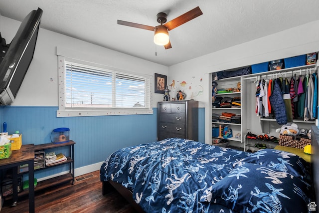 1414 N 325 E, Bountiful, UT 84010 - bedroom with wood finished floors, a closet, wainscoting, ceiling fan, and baseboards