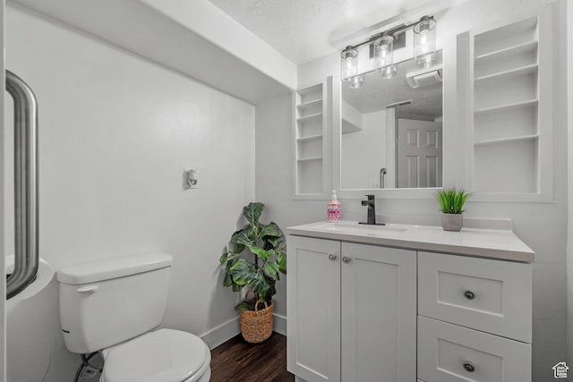 1414 N 325 E, Bountiful, UT 84010 - bathroom featuring wood finished floors, a textured ceiling, toilet, vanity, and baseboards
