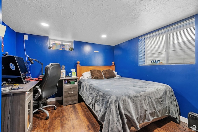 1414 N 325 E, Bountiful, UT 84010 - bedroom featuring wood finished floors, a textured ceiling, baseboards, and recessed lighting