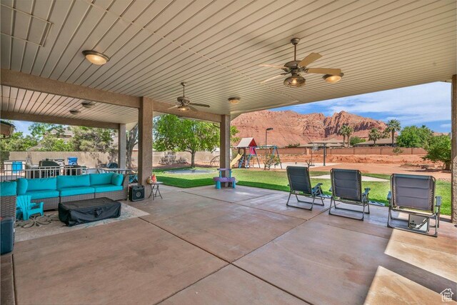 851 E Posado St, Ivins, UT 84738 - view of patio / terrace with outdoor lounge area, a playground, a ceiling fan, and a mountain view