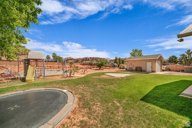 851 E Posado St, Ivins, UT 84738 - view of yard featuring a playground, a trampoline, and an outdoor structure