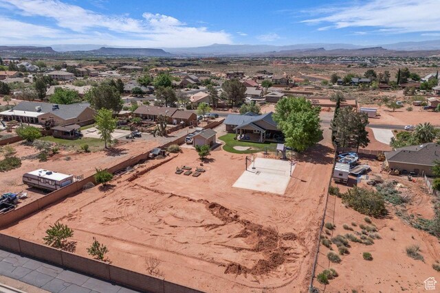 851 E Posado St, Ivins, UT 84738 - aerial overview of property's location with a mountain backdrop and nearby suburban area