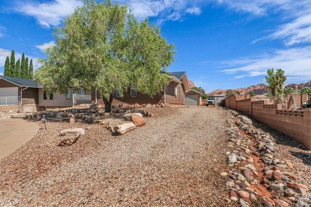 851 E Posado St, Ivins, UT 84738 - view of front of property with fence, a residential view, and brick siding