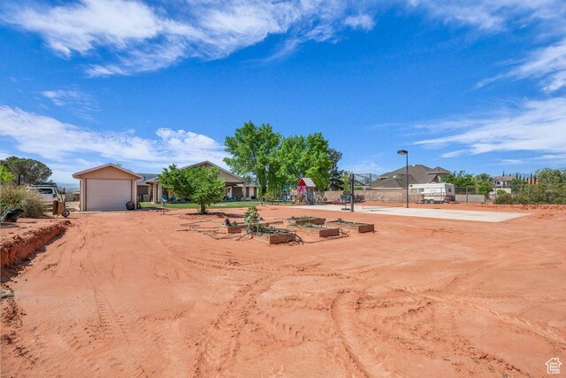 851 E Posado St, Ivins, UT 84738 - view of yard with fence and a garage