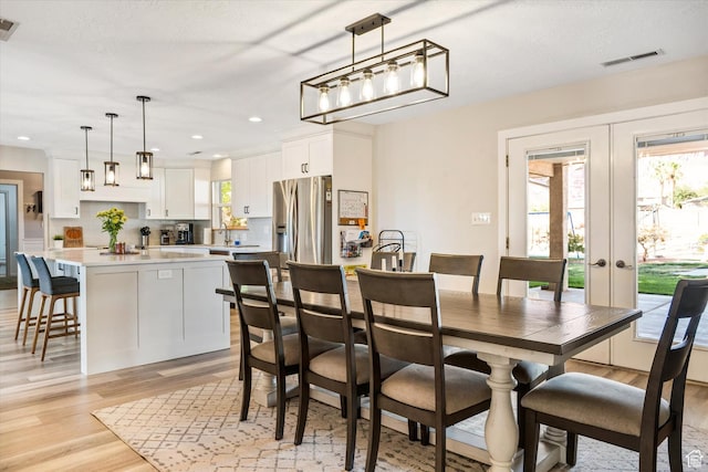 851 E Posado St, Ivins, UT 84738 - dining area featuring light wood finished floors, french doors, and recessed lighting