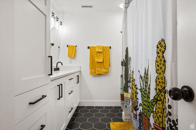 851 E Posado St, Ivins, UT 84738 - full bathroom with tile patterned floors, vanity, baseboards, and a shower with curtain