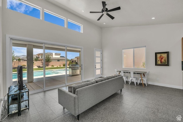 2938 S Poplar Ln, St George, UT 84790 - living area featuring a high ceiling, baseboards, a ceiling fan, and recessed lighting