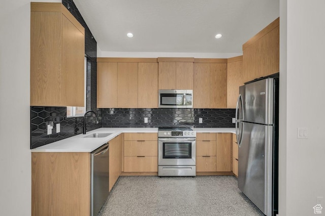 2938 S Poplar Ln, St George, UT 84790 - kitchen with appliances with stainless steel finishes, a sink, light countertops, tasteful backsplash, and light brown cabinetry
