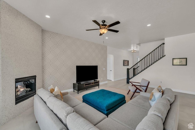 2938 S Poplar Ln, St George, UT 84790 - living area with an accent wall, stairway, wallpapered walls, ceiling fan, and recessed lighting