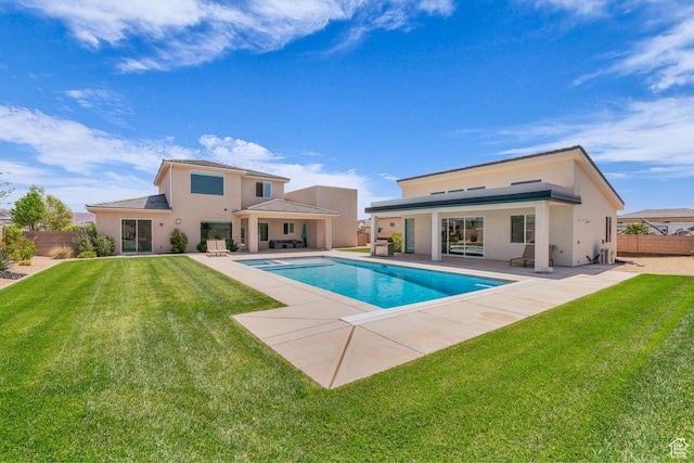 2938 S Poplar Ln, St George, UT 84790 - back of property with stucco siding, a patio, and a pool with connected hot tub
