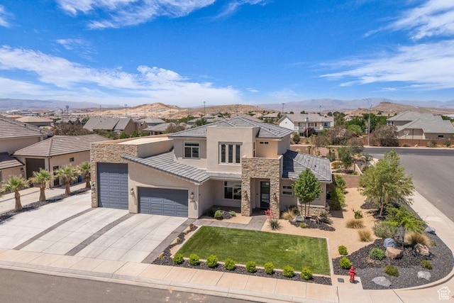 2938 S Poplar Ln, St George, UT 84790 - view of front facade with stone siding, stucco siding, a mountain view, and a residential view