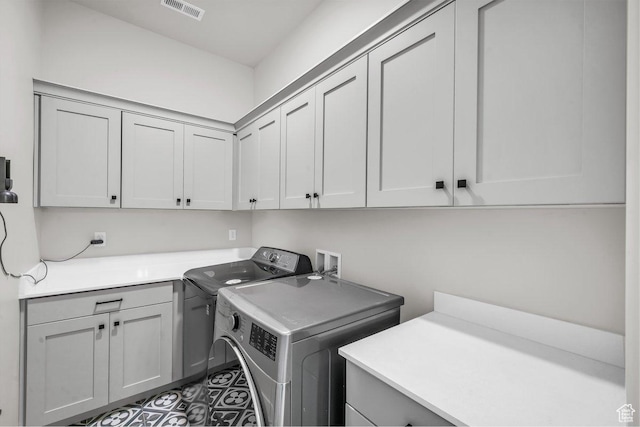 2938 S Poplar Ln, St George, UT 84790 - washroom featuring cabinet space and washing machine and clothes dryer