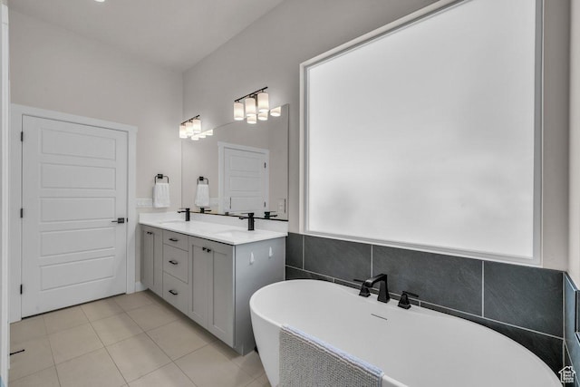2938 S Poplar Ln, St George, UT 84790 - bathroom with vanity, a freestanding bath, and tile patterned floors
