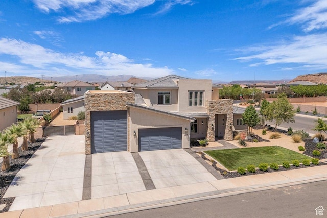 2938 S Poplar Ln, St George, UT 84790 - view of front of house with stone siding, stucco siding, concrete driveway, and an attached garage