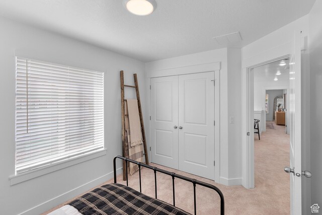 247 W 925 N Unit I49, Brigham City, UT 84302 - bedroom featuring carpet flooring, baseboards, and a closet