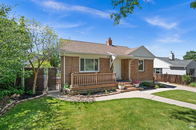 view of front of property with brick siding, a chimney, roof with shingles, and covered porch