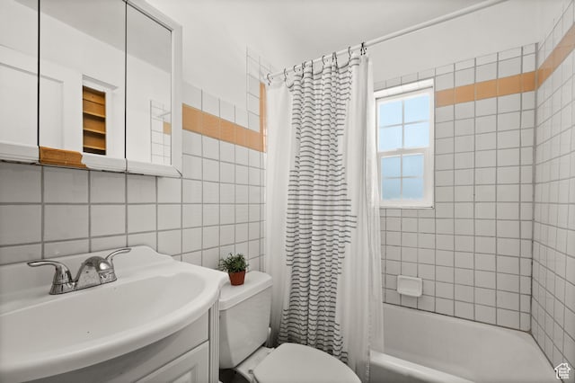 bathroom featuring tile walls, toilet, shower / tub combo with curtain, backsplash, and vanity