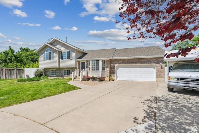 1447 E 230 S, Spanish Fork, UT 84660 - split level home featuring concrete driveway, a garage, brick siding, and roof with shingles