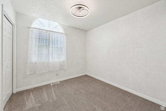 1447 E 230 S, Spanish Fork, UT 84660 - unfurnished room featuring carpet, baseboards, and a textured ceiling
