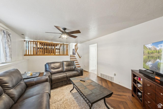 1447 E 230 S, Spanish Fork, UT 84660 - living room featuring a ceiling fan, baseboards, stairs, and a textured ceiling