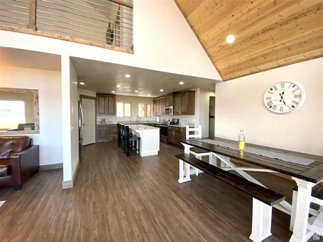 2500 N Bear Lake Blvd, Garden City, UT 84028 - dining area with high vaulted ceiling, baseboards, dark wood-style floors, recessed lighting, and wooden ceiling