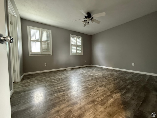 6351 S Moki Cir W, West Jordan, UT 84081 - empty room featuring plenty of natural light, ceiling fan, and dark wood-type flooring
