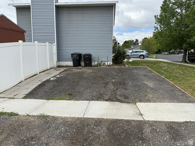 6351 S Moki Cir W, West Jordan, UT 84081 - view of parking with fence