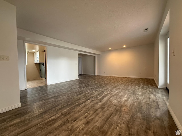 6351 S Moki Cir W, West Jordan, UT 84081 - spare room with dark wood finished floors, baseboards, recessed lighting, and a textured ceiling