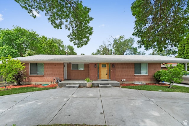 ranch-style home with brick siding