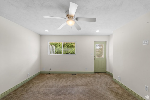 carpeted spare room with baseboards, ceiling fan, and recessed lighting