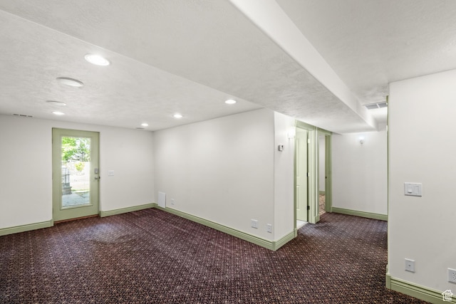 unfurnished room featuring baseboards, carpet flooring, recessed lighting, and a textured ceiling