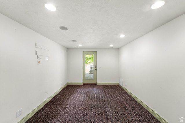 carpeted spare room with recessed lighting and baseboards