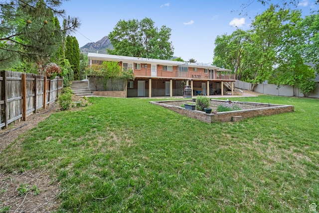 back of property featuring stairway and a deck with mountain view