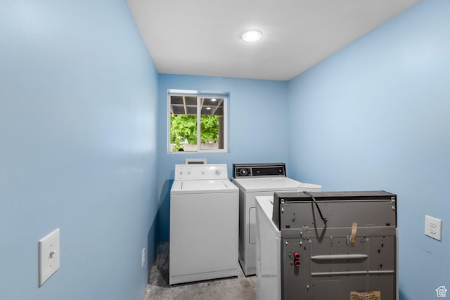 clothes washing area with independent washer and dryer