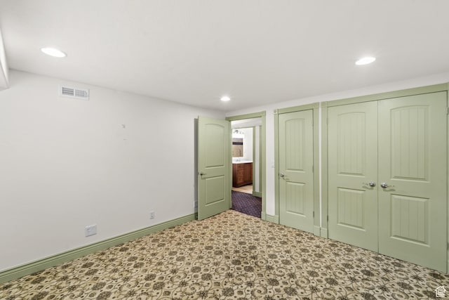 unfurnished bedroom featuring recessed lighting, a closet, and baseboards
