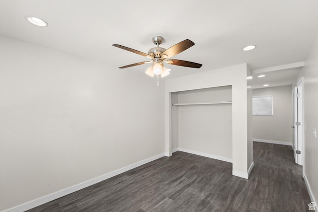 unfurnished bedroom featuring dark wood finished floors, a closet, baseboards, recessed lighting, and a ceiling fan