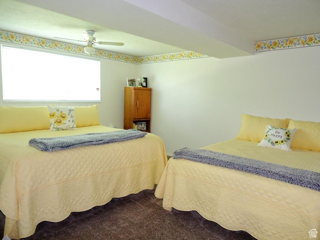 bedroom with dark carpet and ceiling fan