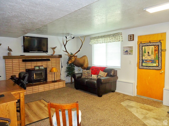 living area featuring a textured ceiling and carpet