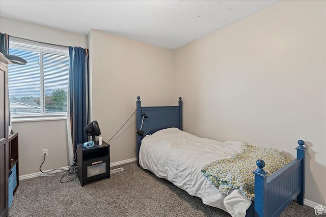 bedroom featuring baseboards and carpet floors